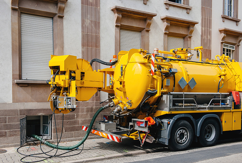 Pump trucks can struggle to reach some commercial grease interceptor locations.